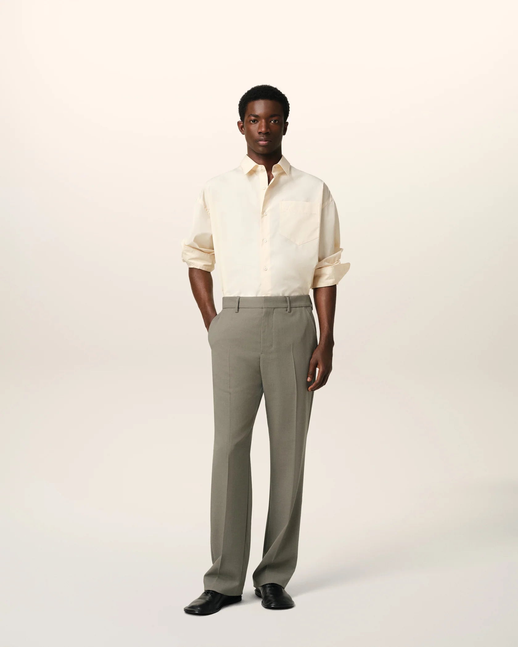 Green pants on a beige background