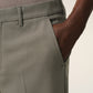 Green pants on a beige background