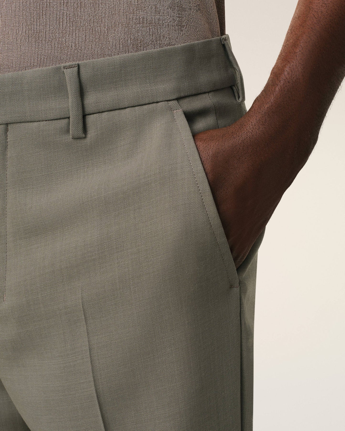 Green pants on a beige background