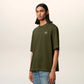Green t-shirt with a small logo on a white background ami paris