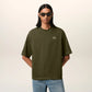 Green t-shirt with a small logo on a white background ami paris