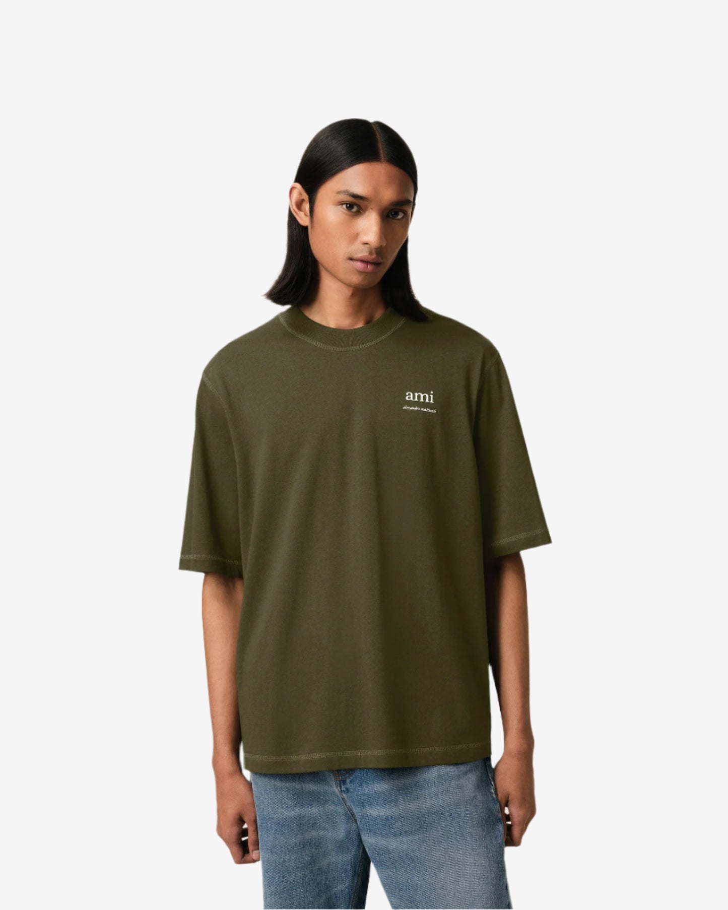 Green t-shirt with a small logo on a white background ami paris