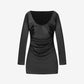 Black long-sleeve dress on a light gray background