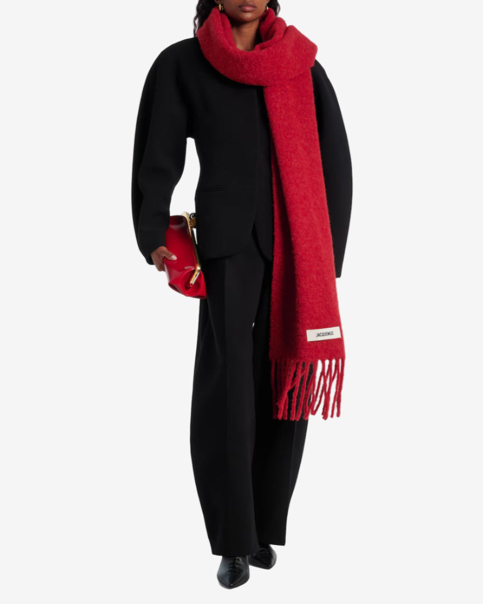 Person wearing a red scarf with a brand logo on a white background