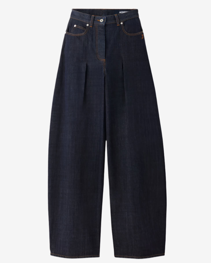Dark blue jeans on a light gray background