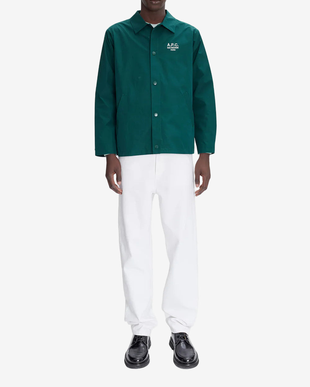 Green shirt with a brand logo on a white background