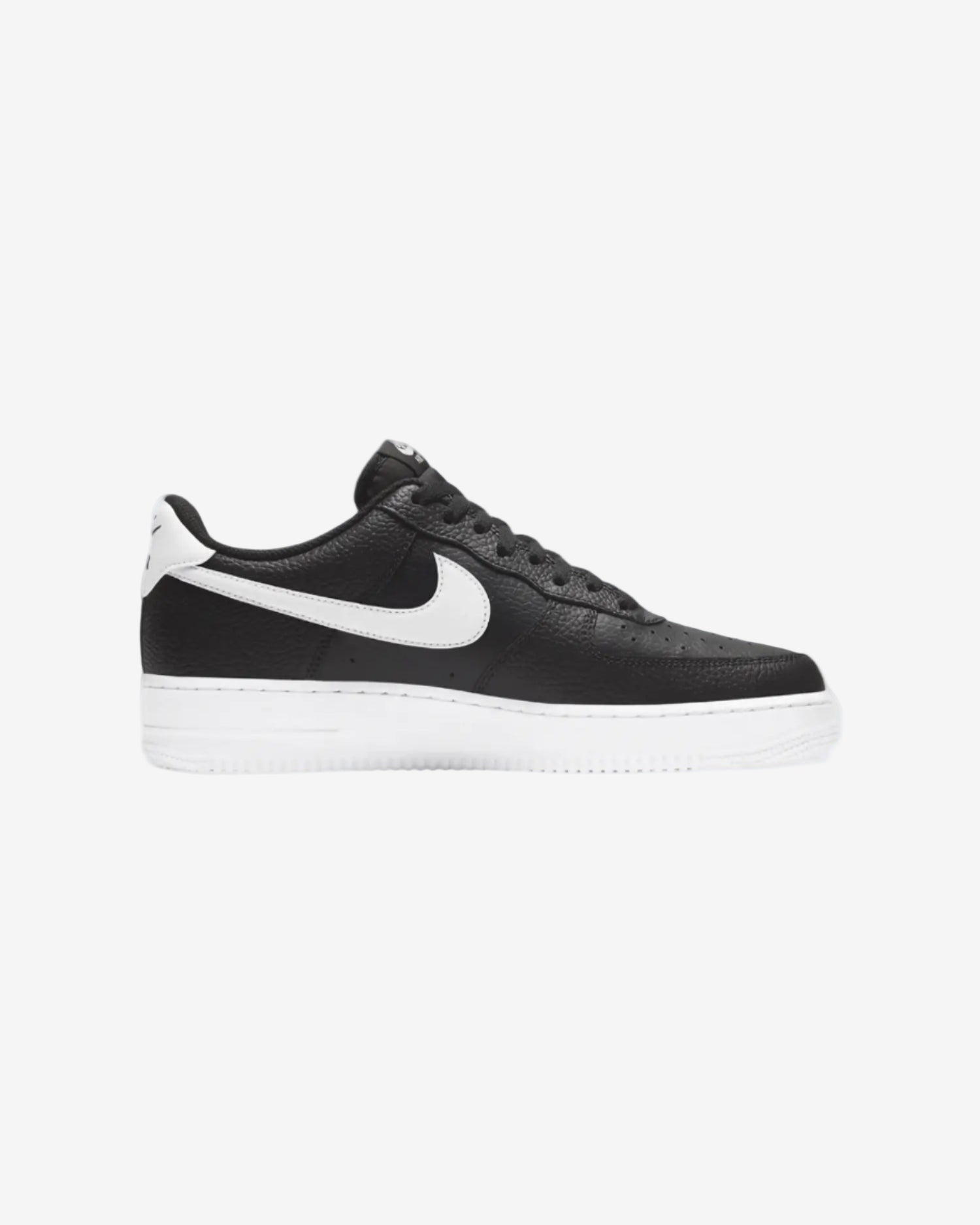 Black and white sneaker with Nike logo on a light gray background