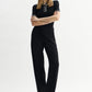 Black polo shirt in viscose blend with contrasting stripes