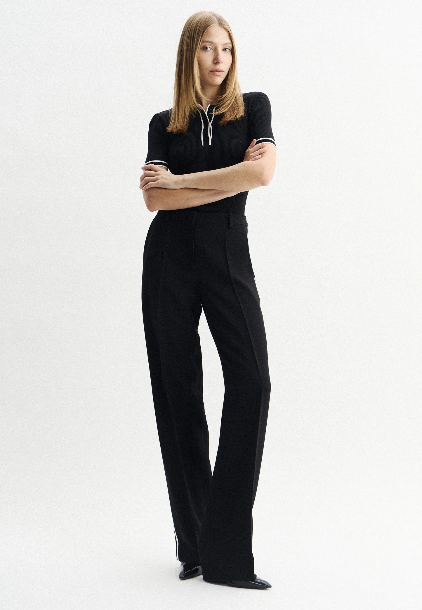 Black polo shirt in viscose blend with contrasting stripes