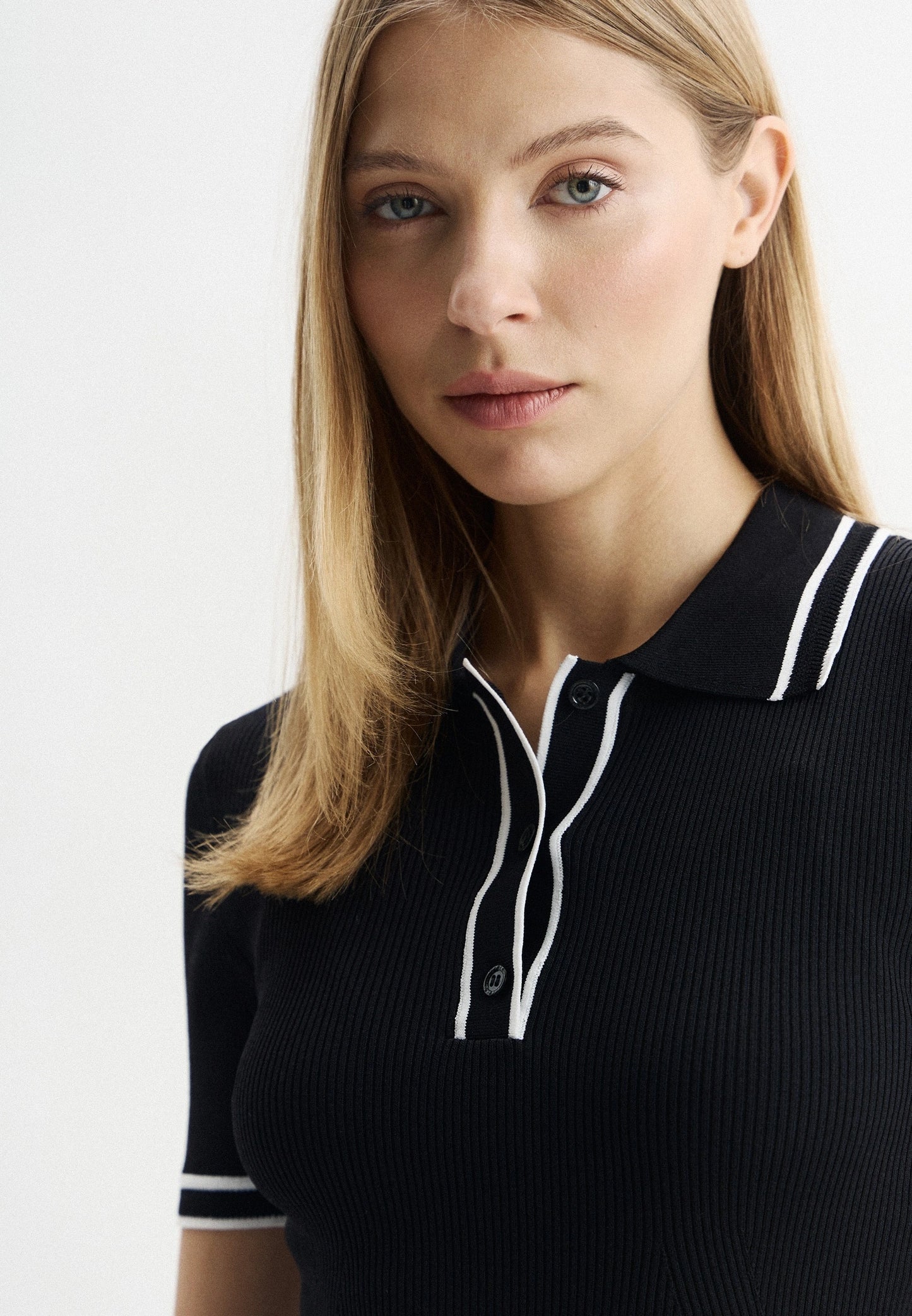 Black polo shirt in viscose blend with contrasting stripes
