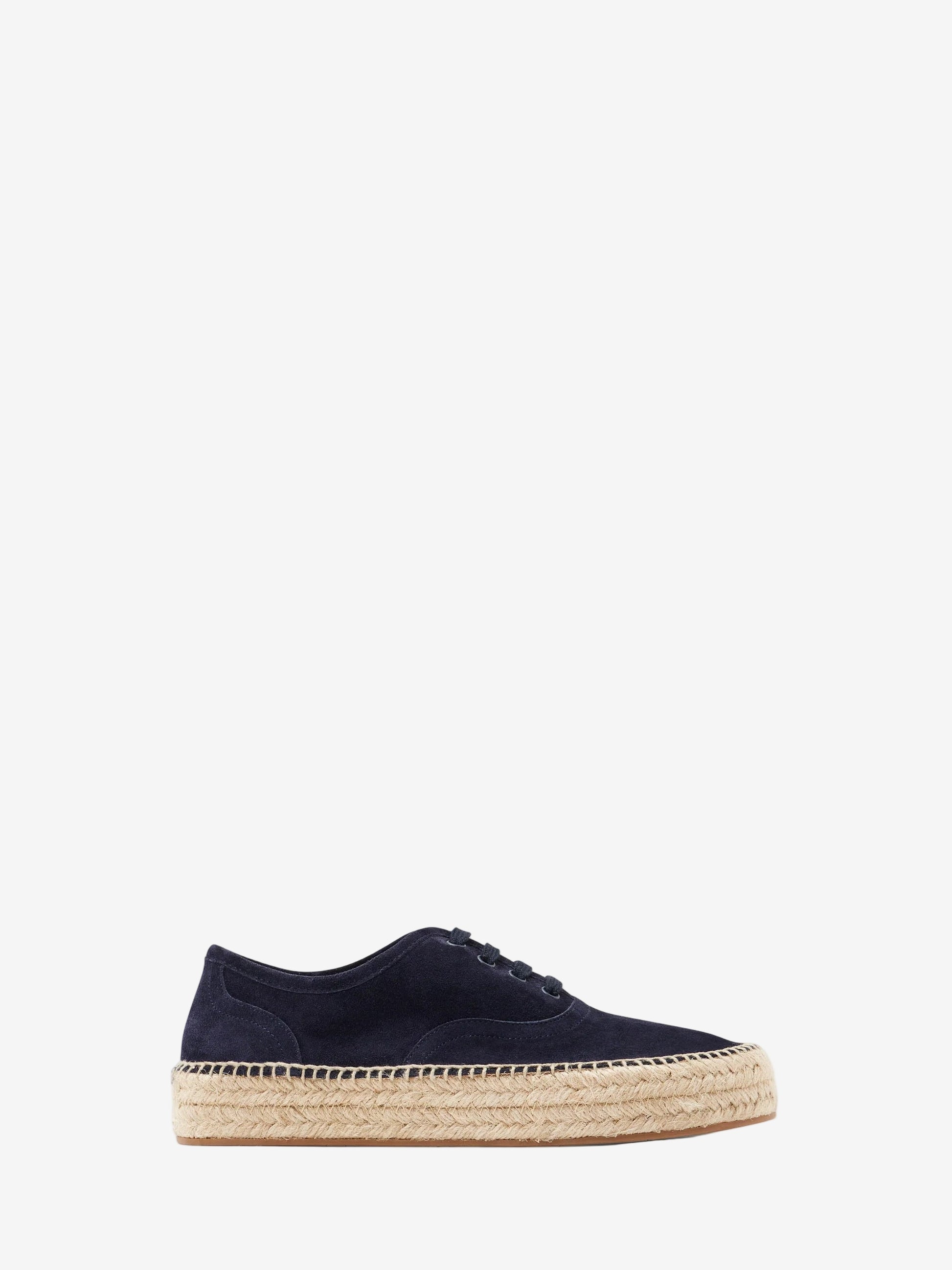 Navy blue espadrille shoe on a white background