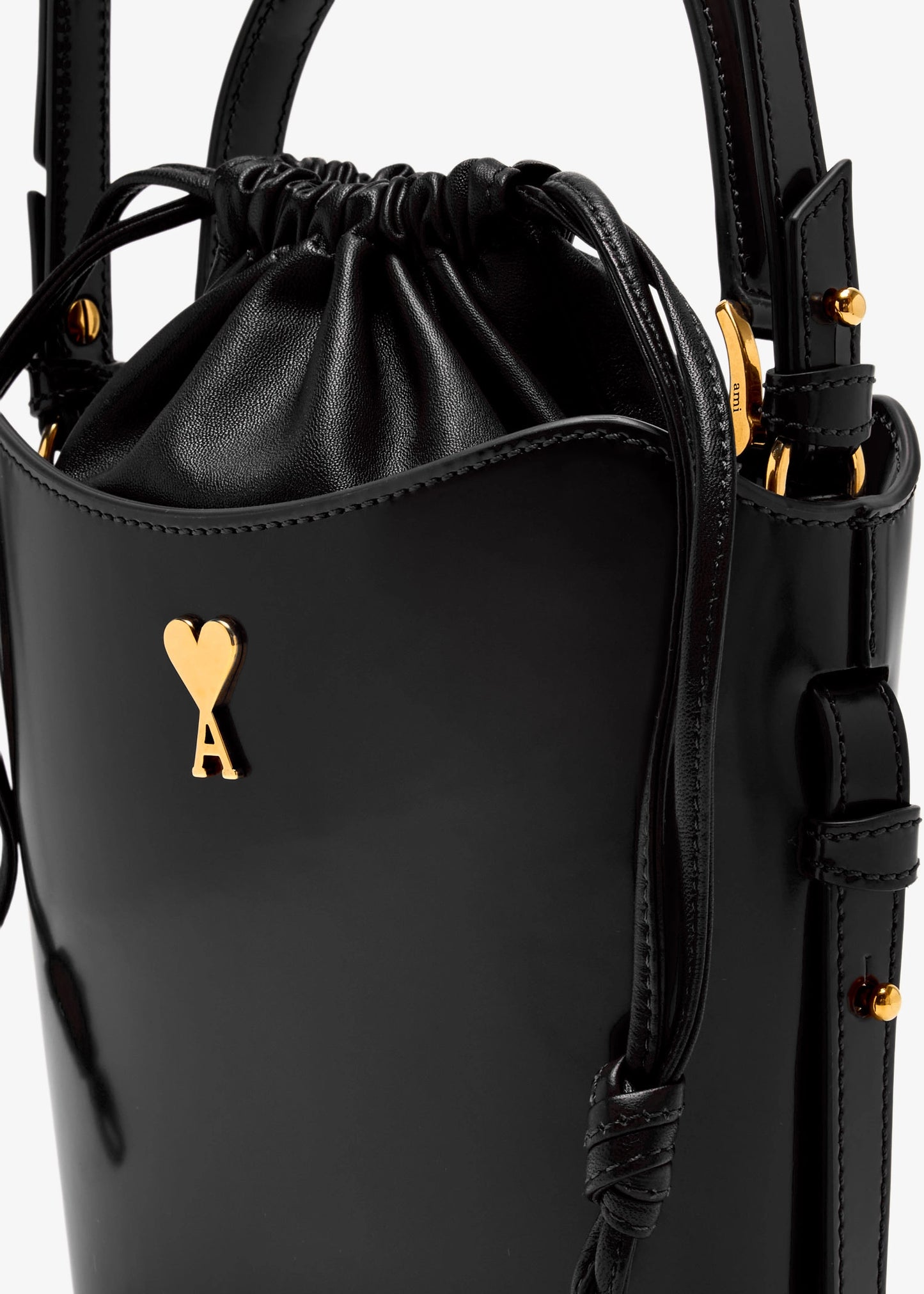 Black drawstring bag with a heart-shaped key emblem on a white background