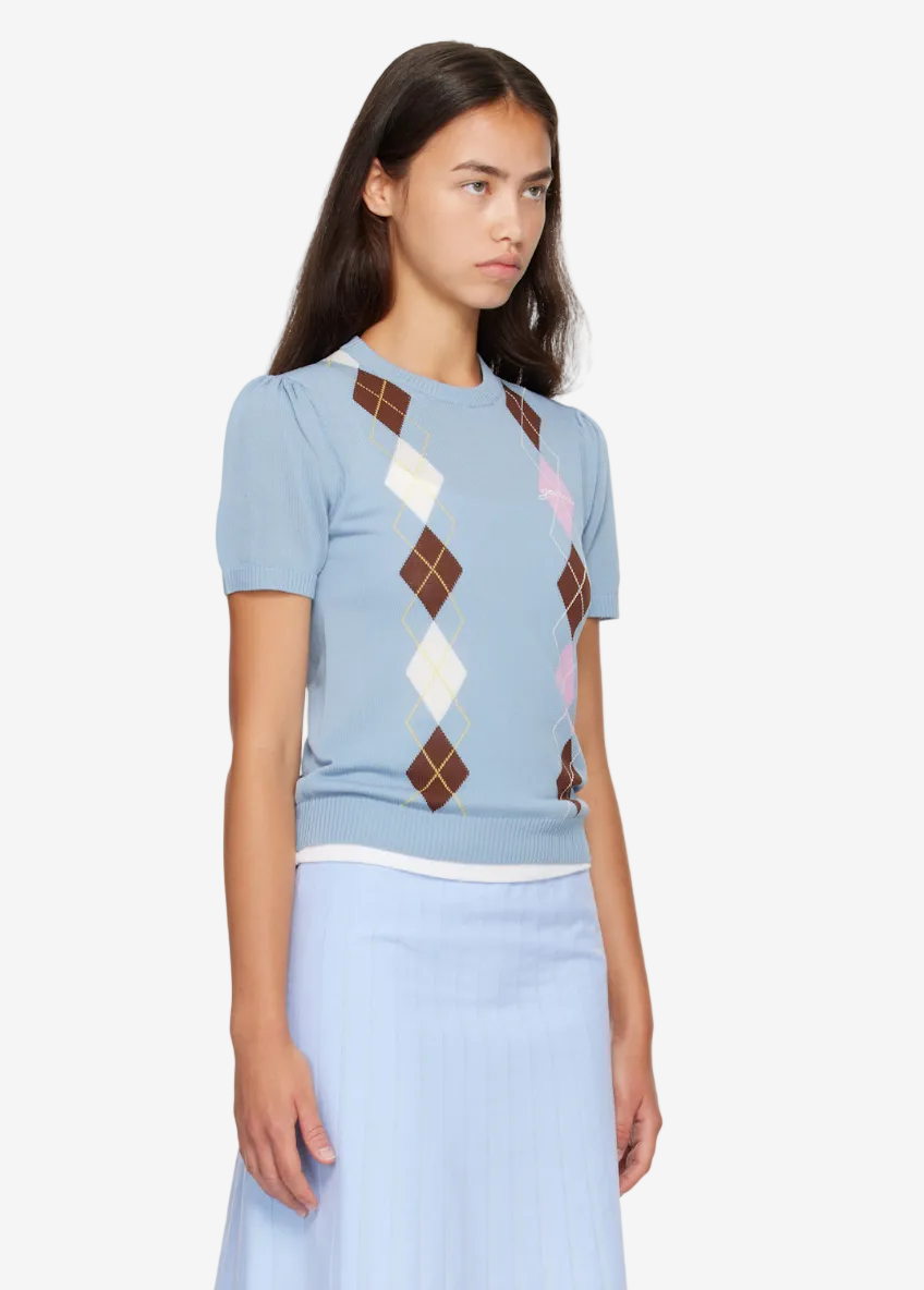 Light blue t-shirt with argyle pattern on a white background