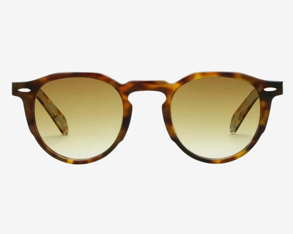 Round sunglasses with tortoiseshell frame and brown gradient lenses on a white background