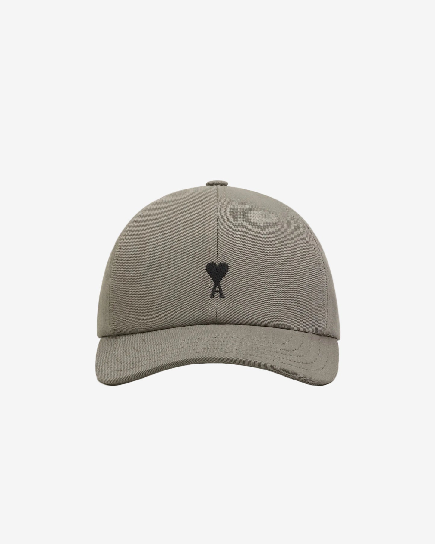 Gray cap with a black logo on a beige background ami paris