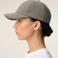 Gray cap with a black logo on a beige background ami paris