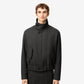 Black jacket on a beige background