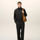 Black jacket on a beige background