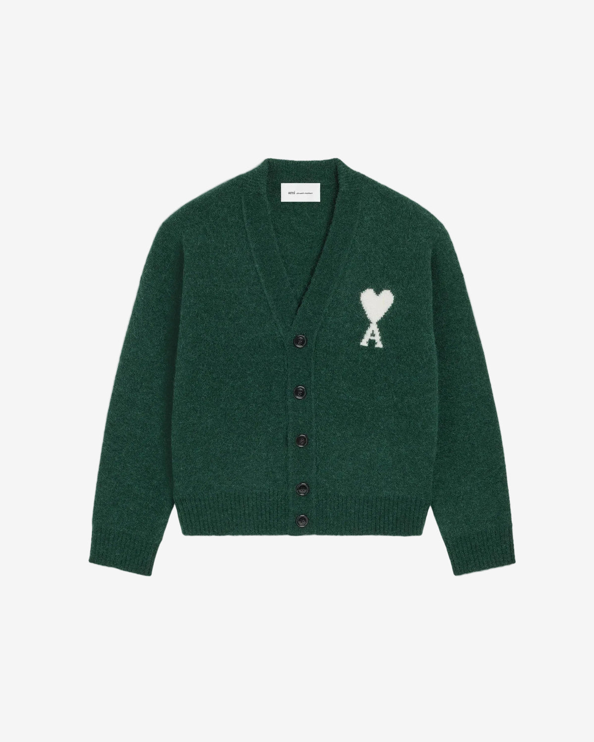 Green cardigan with a heart and 'A' emblem on a beige background