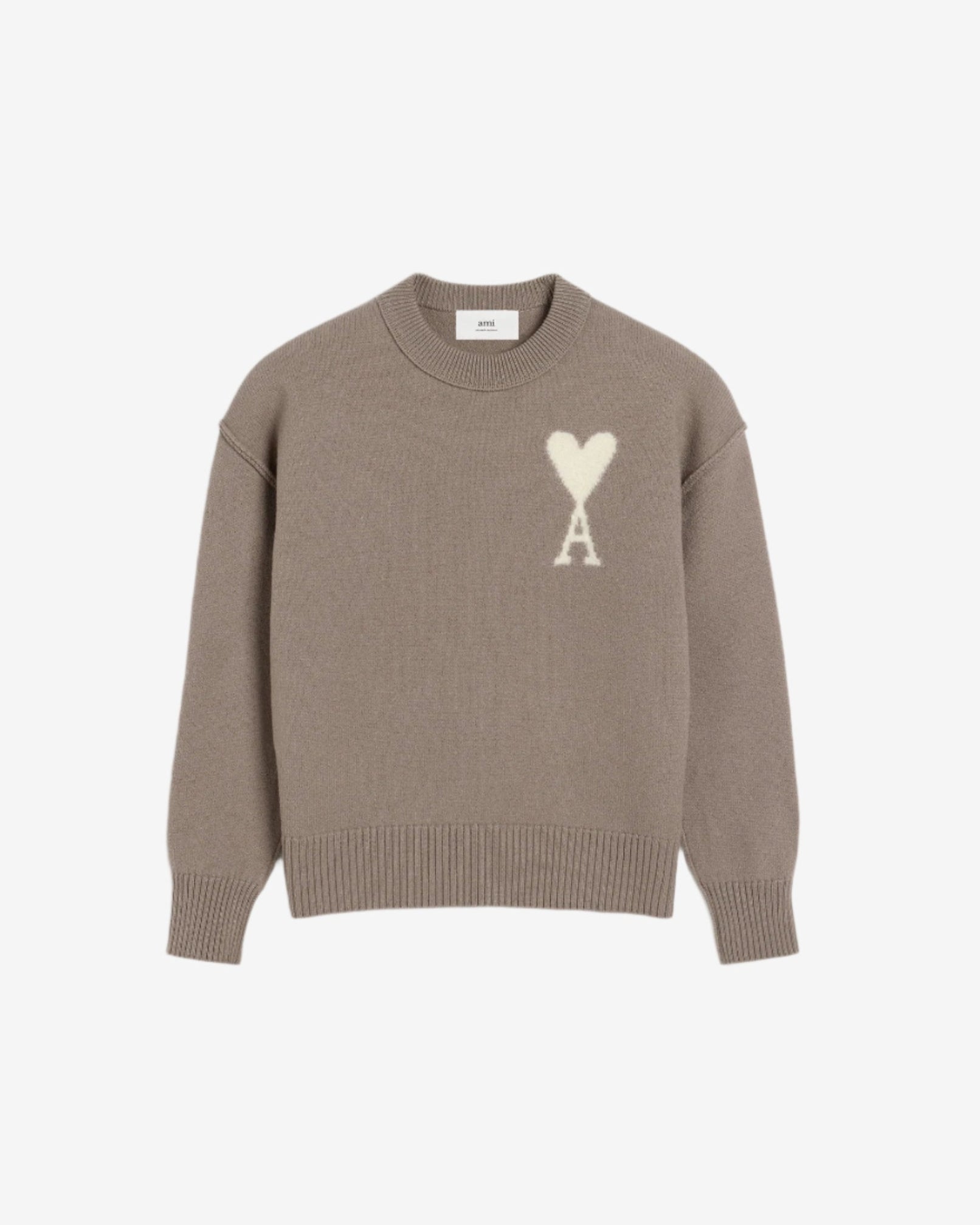 Brown sweater with a logo on a beige background