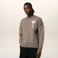 Brown sweater with a logo on a beige background