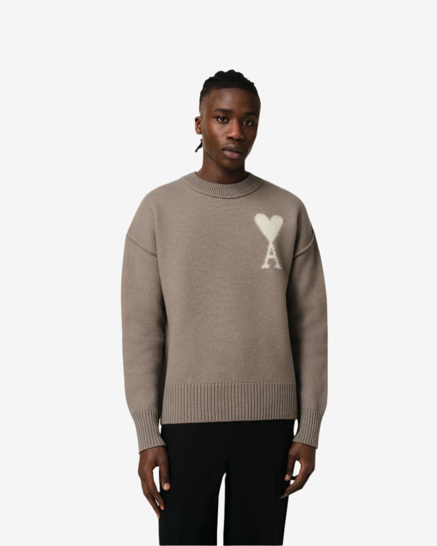 Brown sweater with a logo on a beige background