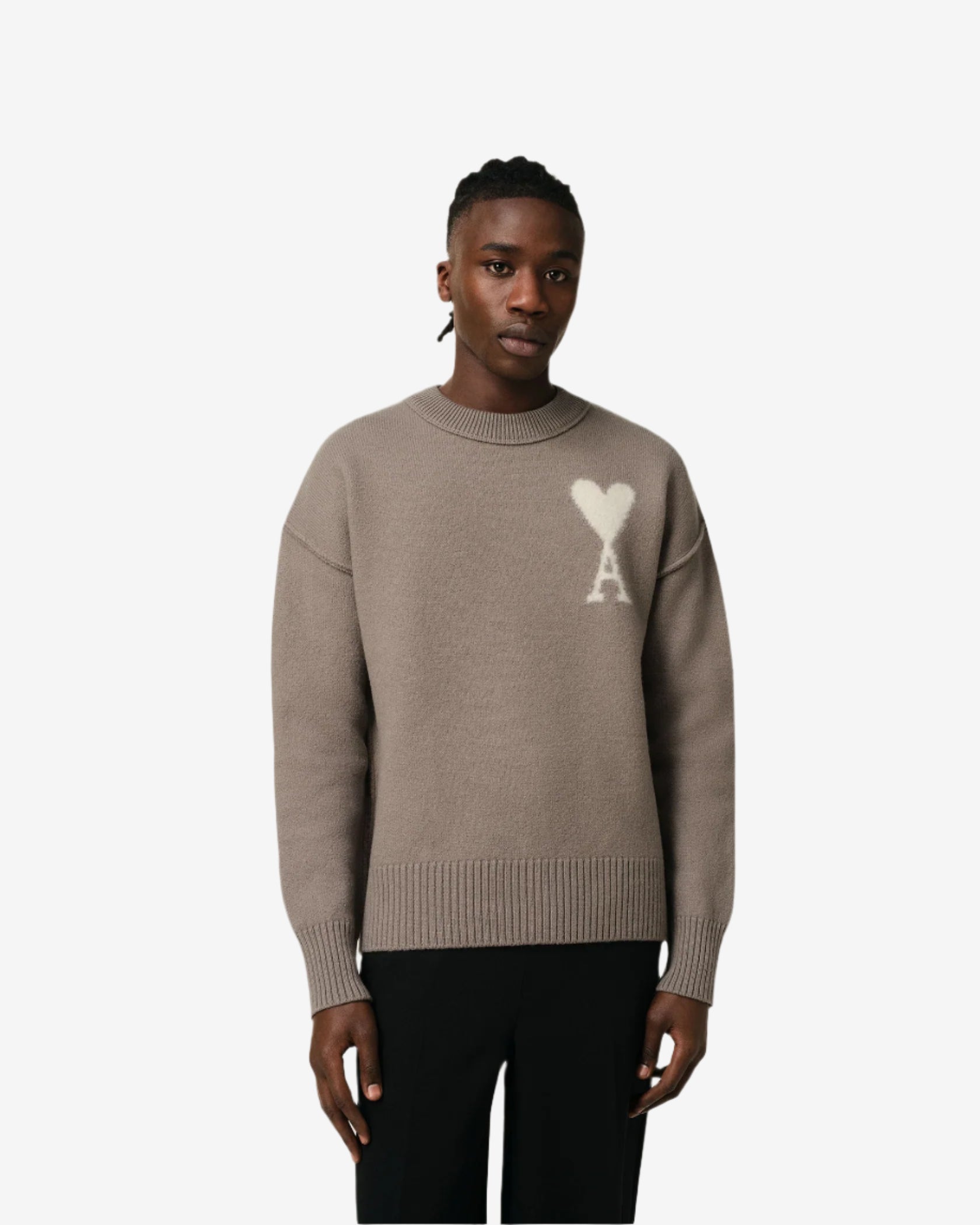Brown sweater with a logo on a beige background