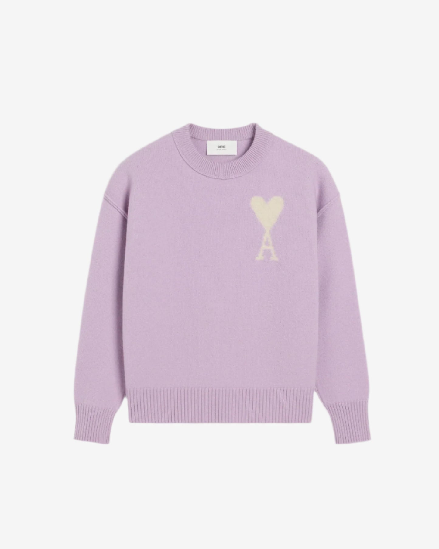 Lavender sweater with a heart design on a light beige background
