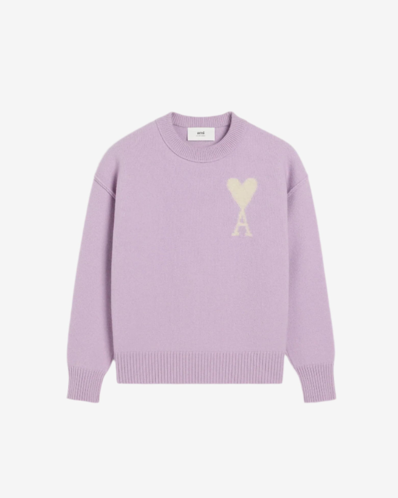 Lavender sweater with a heart design on a light beige background