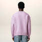 Lavender sweater with a heart design on a light beige background
