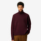 Maroon turtleneck sweater on a beige background