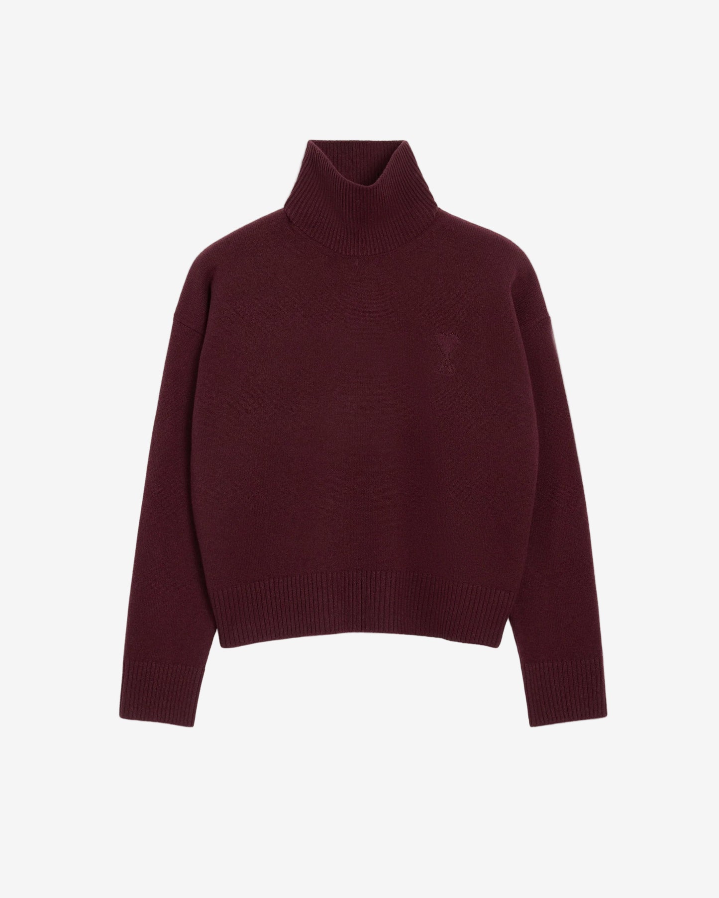 Maroon turtleneck sweater on a beige background