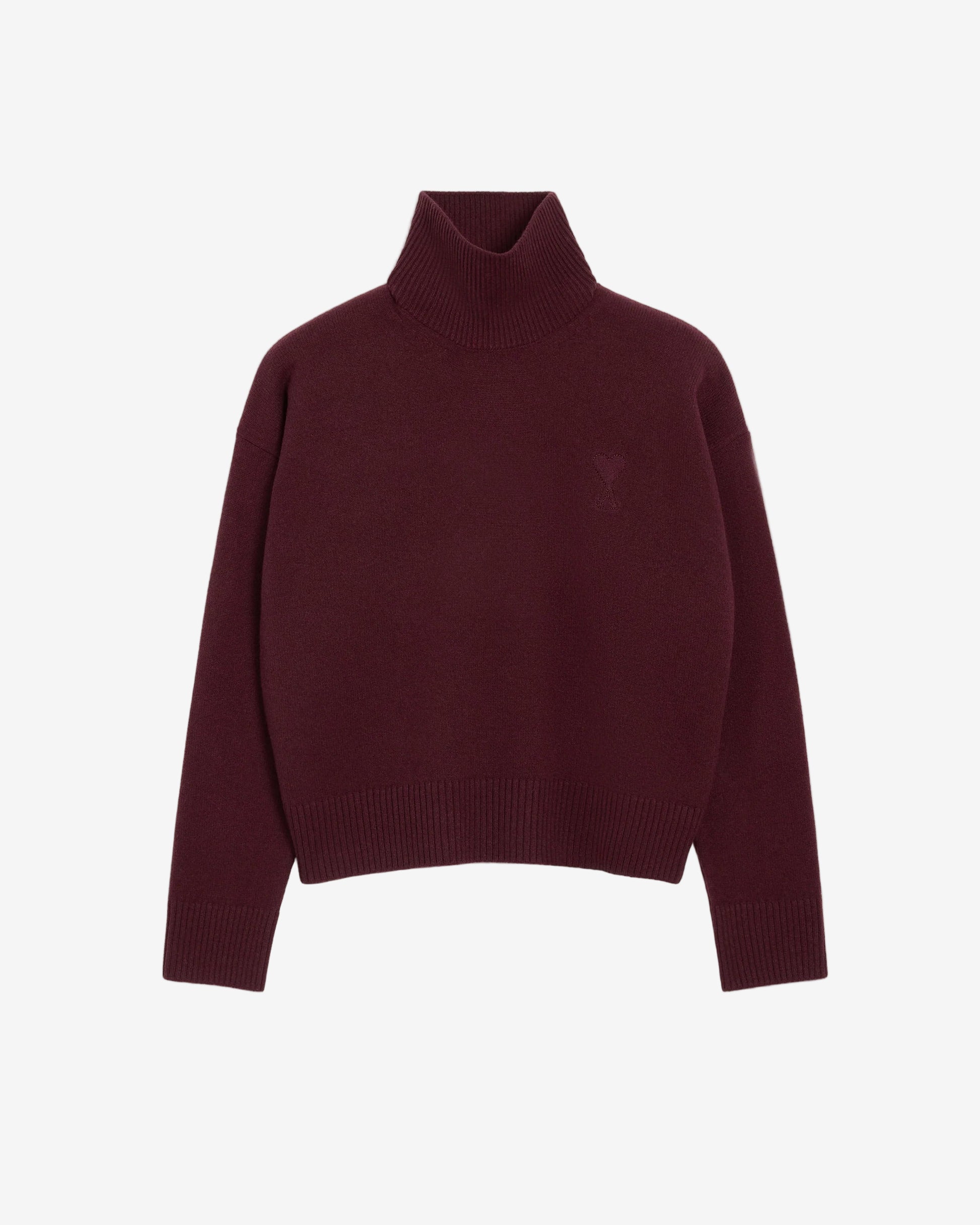 Maroon turtleneck sweater on a beige background