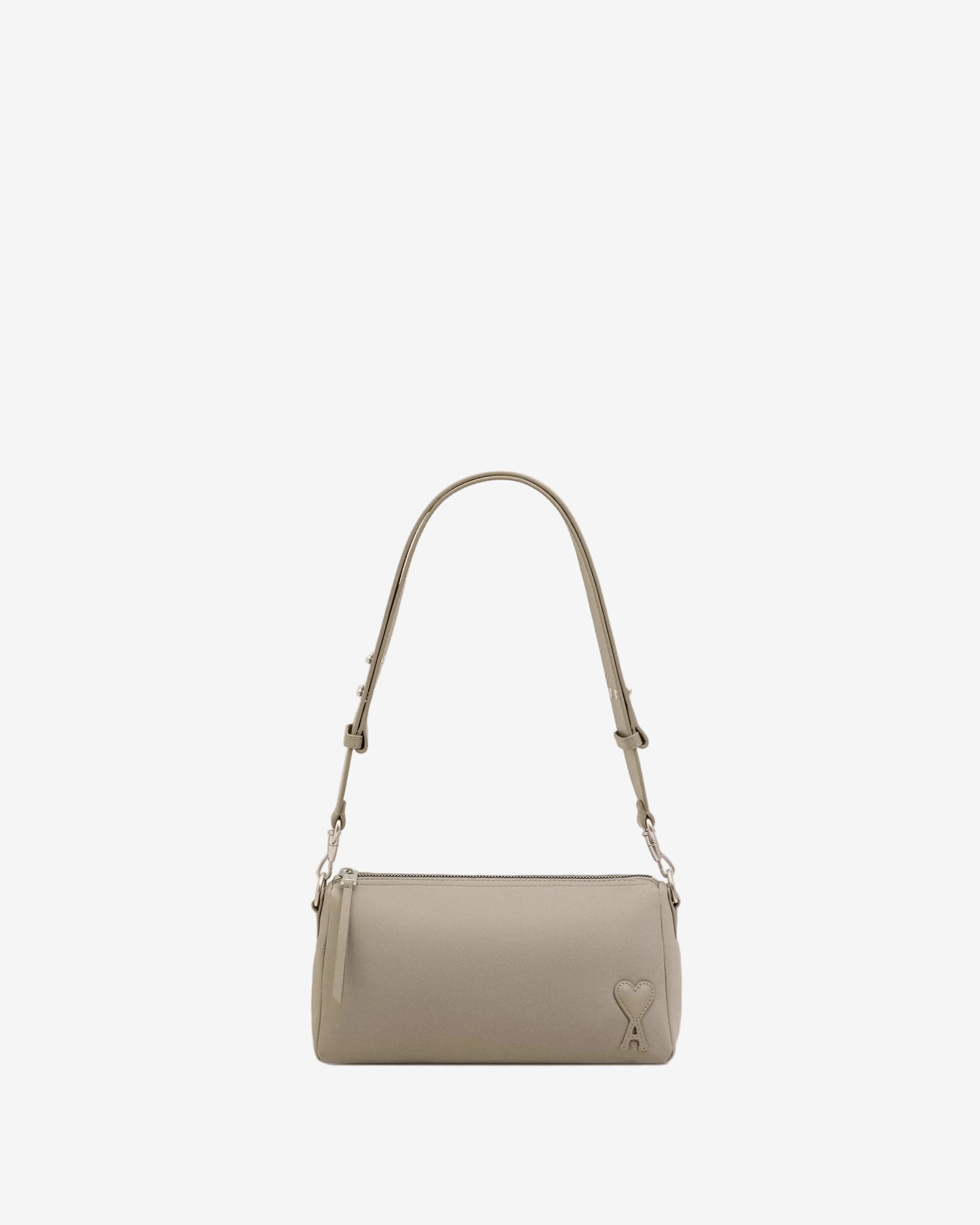 Light gray handbag with a heart detail on a light beige background ami paris
