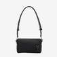 Black handbag with a strap on a light beige background