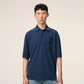 Navy blue polo shirt with a small logo on a beige background ami paris