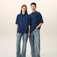 Navy blue polo shirt with a small logo on a beige background ami paris