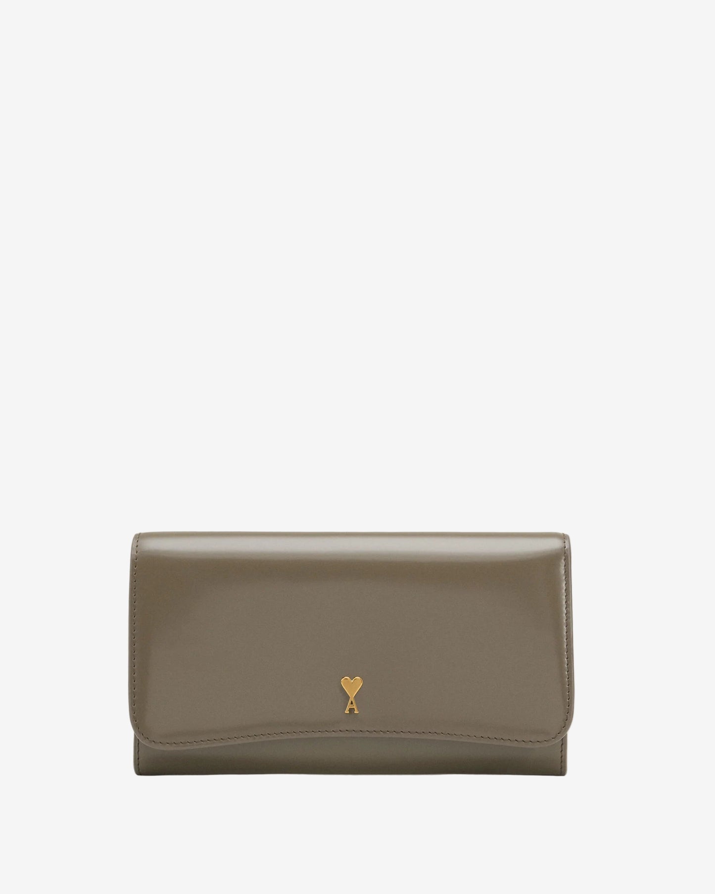 Green wallet with a small logo on a beige background