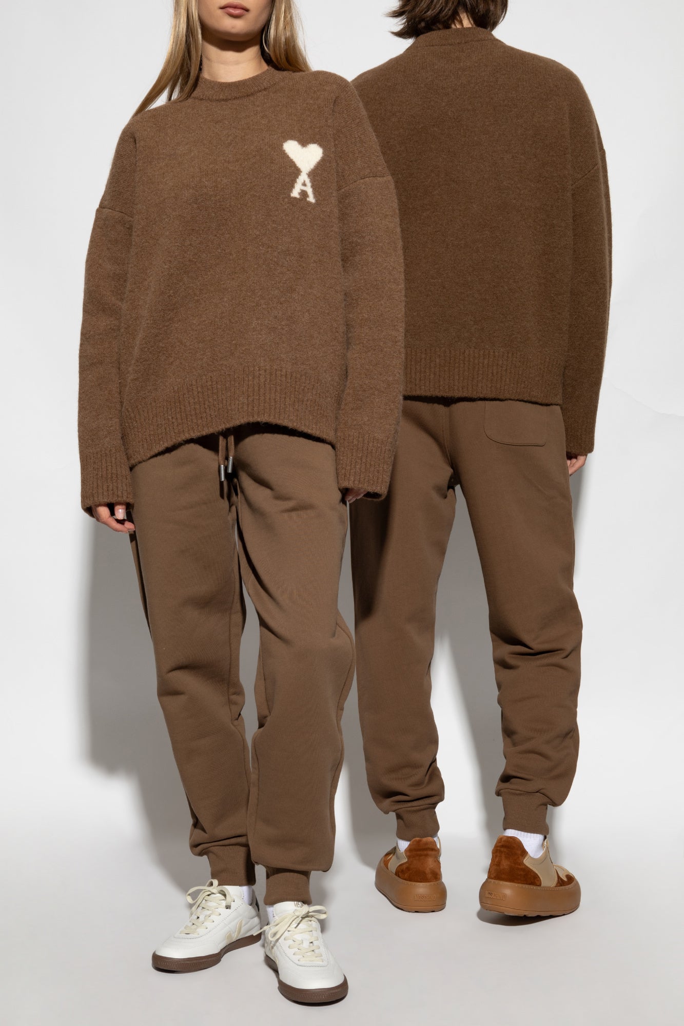 Brown sweatpants with a drawstring on a white background