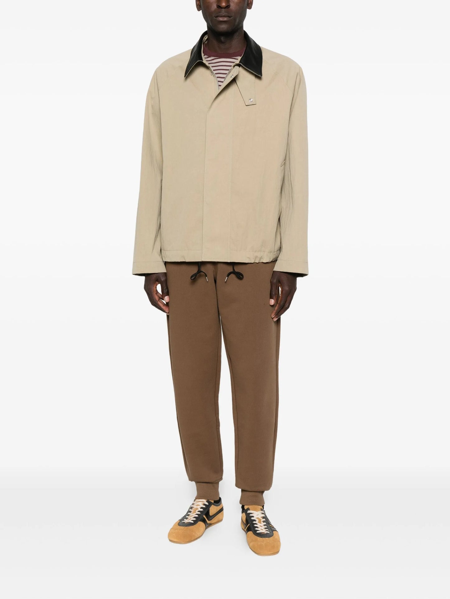Brown sweatpants with a drawstring on a white background