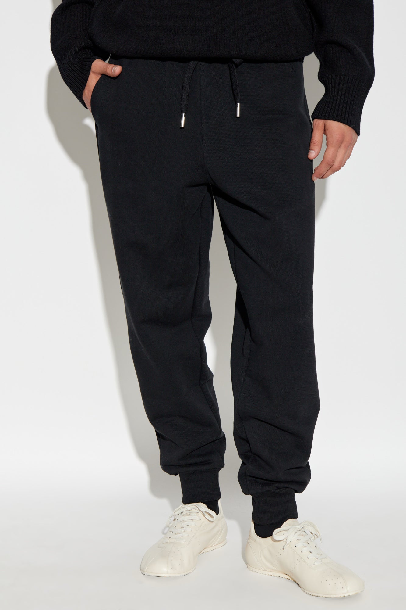 Black sweatpants on a white background