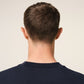 Navy blue t-shirt with 'AMI PARIS' text on a light gray background