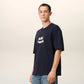 Navy blue t-shirt with 'AMI PARIS' text on a light gray background