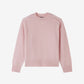 Pink sweater on a white background
