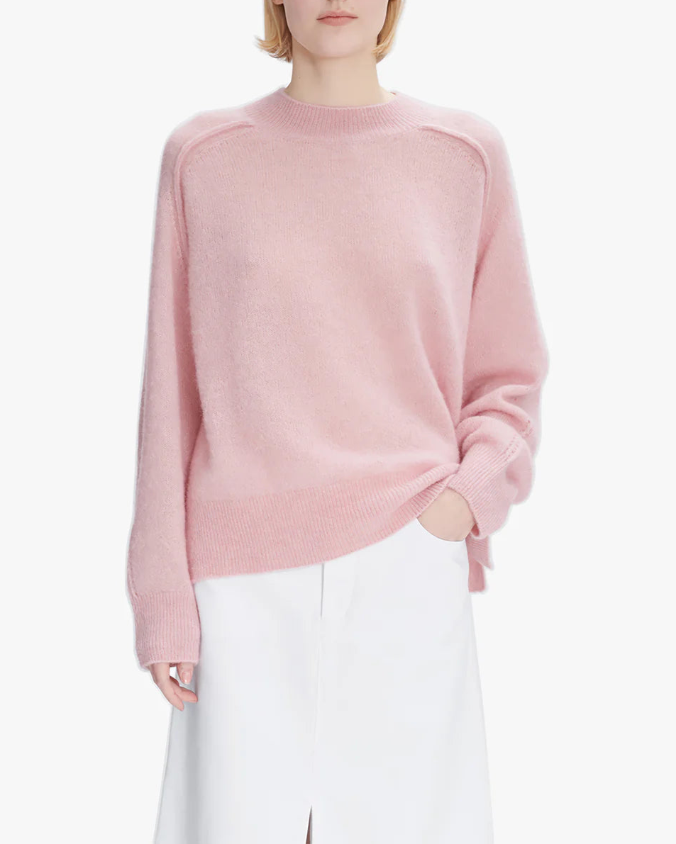 Pink sweater on a white background