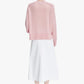 Pink sweater on a white background
