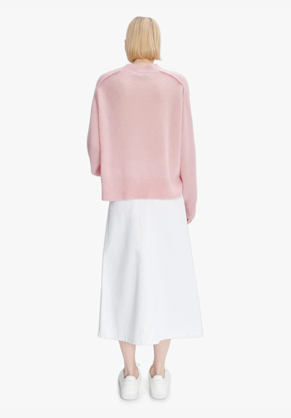 Pink sweater on a white background