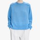 Blue sweater on a white background