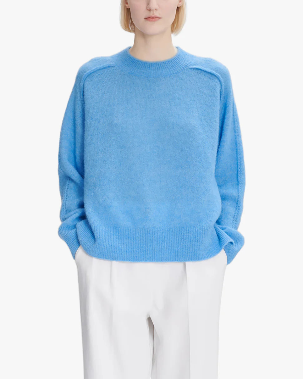 Blue sweater on a white background