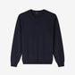 Navy blue sweater with a brand logo on a light gray background